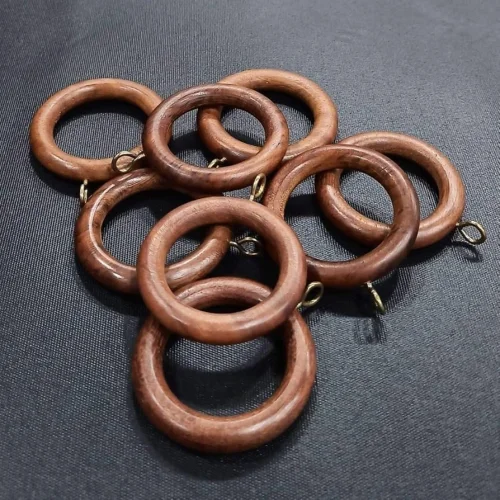 Natural wooden curtain rings.