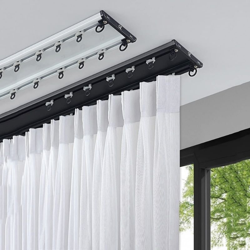 Double curtain track for layered drapes
